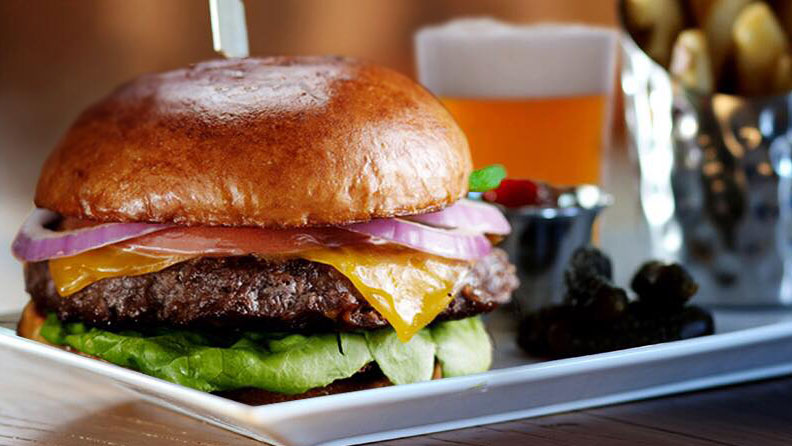 burger with red onion, lettuce, tomato and cheese